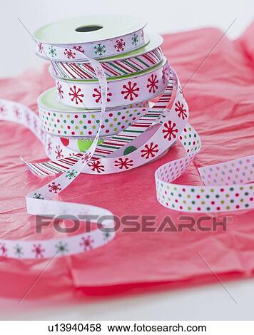 Stack of colorful ribbons on wrapping paper View Large Photo Image Stock Photo - Stack of colorful ribbons on wrapping paper. Fotosearch