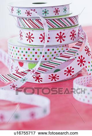 Stack of colorful ribbons on wrapping paper View Large Photo Image Stock Photo - Stack of colorful ribbons on wrapping paper. Fotosearch