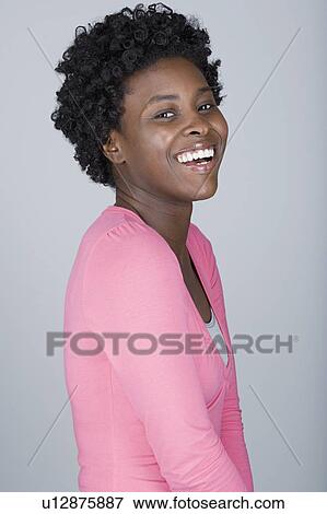 Studio portrait of confident mid adult woman View Large Photo Image Stock Photo - Studio portrait of confident mid adult woman. Fotosearch