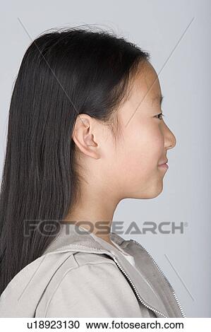 Studio portrait of happy Chinese teenage girl (16-17) View Large Photo Image Stock Image - Studio portrait of happy Chinese teenage girl (16-17). Fotosearch
