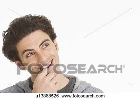 Studio portrait of man smiling View Large Photo Image Stock Photograph - Studio portrait of man smiling. Fotosearch