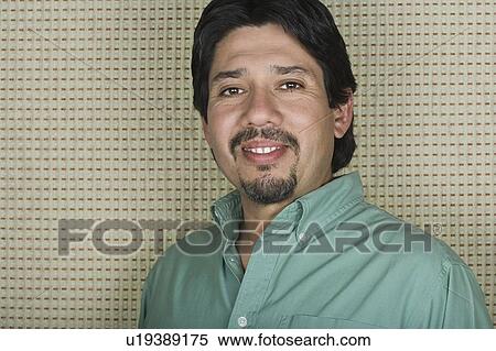 Stock Photography - Studio portrait of mature man. Fotosearch