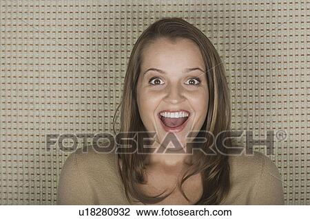 Studio portrait of mature woman laughing View Large Photo Image Stock Image - Studio portrait of mature woman laughing. Fotosearch