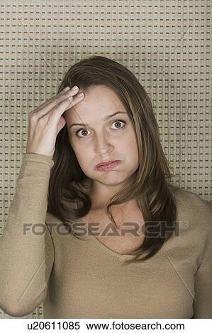 Studio portrait of mature woman pouting View Large Photo Image Stock Photography - Studio portrait of mature woman pouting. Fotosearch