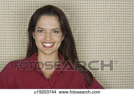 Studio portrait of mid adult woman smiling View Large Photo Image Picture - Studio portrait of mid adult woman smiling. Fotosearch