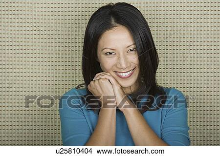 Studio portrait of mid adult woman smiling View Large Photo Image Picture - Studio portrait of mid adult woman smiling. Fotosearch