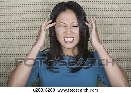 Studio portrait of mid adult woman with head in hands View Large Photo Image Stock Photo - Studio portrait of mid adult woman with head in hands. Fotosearch