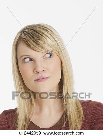 Studio portrait of pensive woman View Large Photo Image Stock Photo - Studio portrait of pensive woman. Fotosearch