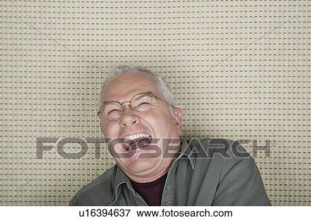 Studio portrait of senior man laughing View Large Photo Image Stock Photo - Studio portrait of senior man laughing. Fotosearch