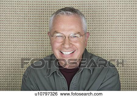 Studio portrait of senior man smiling View Large Photo Image Stock Photograph - Studio portrait of senior man smiling. Fotosearch