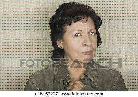 Stock Photo - Studio portrait of senior woman. Fotosearch