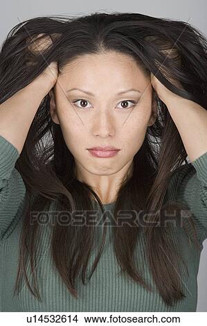 Studio portrait of stressed Chinese woman View Large Photo Image Picture - Studio portrait of stressed Chinese woman. Fotosearch