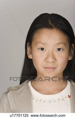 Stock Photography - Studio portrait of teen (16-17) girl. Fotosearch