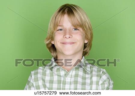 Stock Photo - Studio portrait of teenage (16-17) boy. Fotosearch