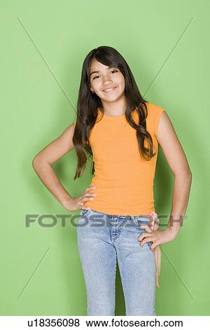 Studio portrait of teenage (16-17) girl smiling View Large Photo Image Stock Photo - Studio portrait of teenage (16-17) girl smiling. Fotosearch
