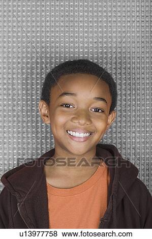 Stock Photo - Studio portrait of young man smiling. Fotosearch