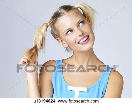 Picture - Studio portrait of young woman. Fotosearch