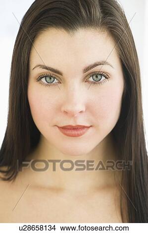 Picture - Studio portrait of young woman. Fotosearch