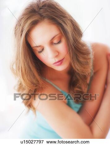 Studio portrait of young woman View Large Photo Image Stock Photo - Studio portrait of young woman. Fotosearch