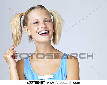 Studio portrait of young woman View Large Photo Image Stock Photo - Studio portrait of young woman. Fotosearch