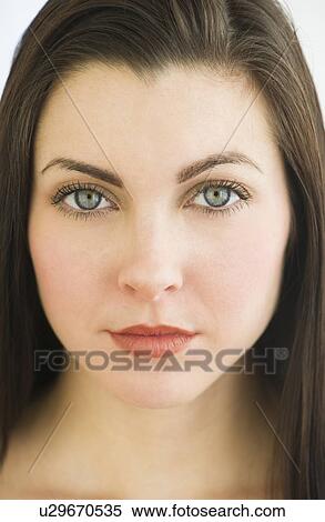Stock Photography - Studio portrait of young woman. Fotosearch