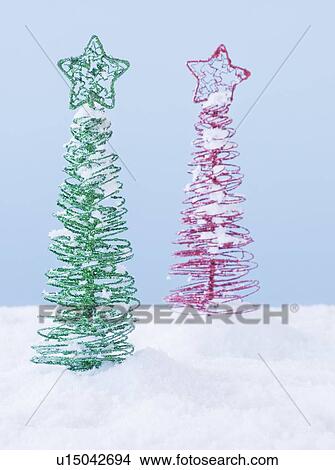 Picture - Studio shot of artificial Christmas trees. Fotosearch