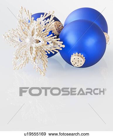 Stock Photo - Studio shot of blue Christmas ornament. Fotosearch