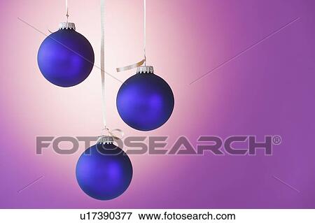 Stock Photo - Studio shot of blue Christmas ornaments. Fotosearch