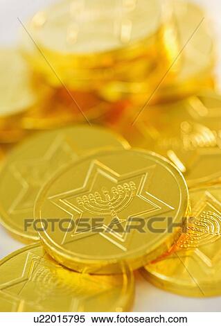 Stock Photography - Studio Shot of chocolate coin. Fotosearch