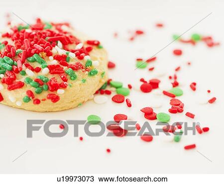 Stock Image - Studio Shot of christmas cookie with sprinkles. Fotosearch