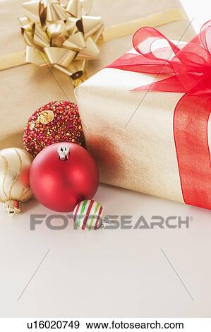 Stock Photo - Studio shot of Christmas ornaments and presents. Fotosearch