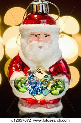 Stock Image - Studio shot of Christmas Santa ornament. Fotosearch