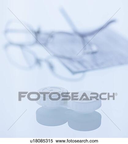 Stock Photography - Studio shot of contact lens and spectacles. Fotosearch