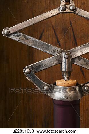 Studio shot of corkscrew opening bottle View Large Photo Image Stock Image - Studio shot of corkscrew opening bottle. Fotosearch