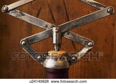Studio shot of corkscrew opening bottle View Large Photo Image Stock Photo - Studio shot of corkscrew opening bottle. Fotosearch