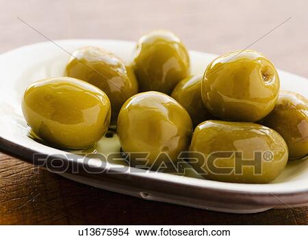 Picture - Studio shot of fresh olives. Fotosearch