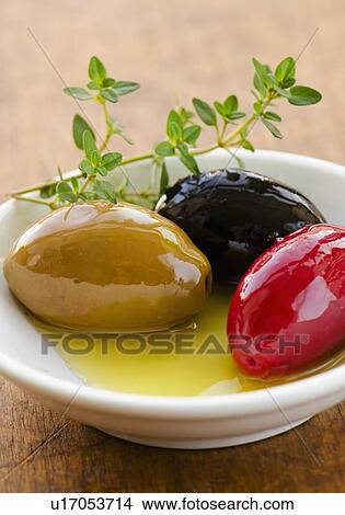 Picture - Studio shot of fresh olives. Fotosearch