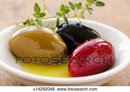Stock Photo - Studio shot of fresh olives. Fotosearch