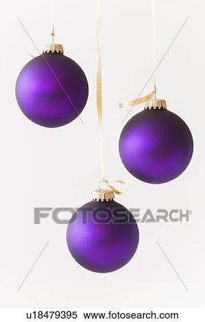 Stock Photography - Studio shot of purple Christmas ornaments. Fotosearch