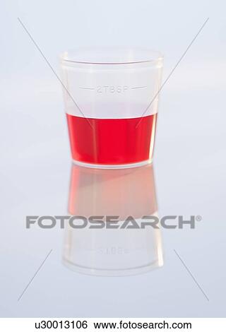 Stock Photograph - Studio shot of red medicine. Fotosearch