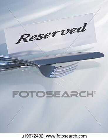 Studio shot of silverware and Reserved sign View Large Photo Image Stock Image - Studio shot of silverware and Reserved sign. Fotosearch