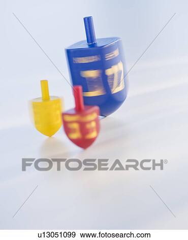 Stock Photo - Studio Shot of spinning dreildels. Fotosearch