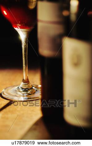 Studio shot of wine glass and bottles View Large Photo Image Stock Photo - Studio shot of wine glass and bottles. Fotosearch