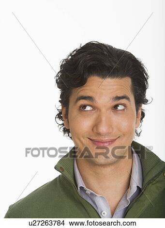 Studio shot of young man smiling View Large Photo Image Picture - Studio shot of young man smiling. Fotosearch
