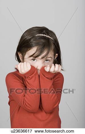 Stock Photo - Studio shot portrait of girl, waist up. Fotosearch