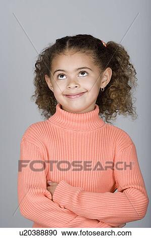 Studio shot portrait of girl with arms crossed, waist up View Large Photo Image Stock Image - Studio shot portrait of girl with arms crossed, waist up. Fotosearch
