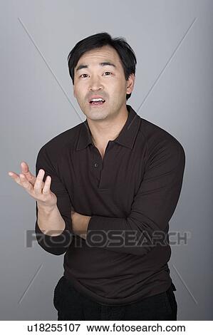 Studio shot portrait of mature man gesturing, waist up View Large Photo Image Stock Photo - Studio shot portrait of mature man gesturing, waist up. Fotosearch