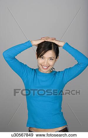 Studio shot portrait of mature woman with arms raised, waist up View Large Photo Image Stock Photo - Studio shot portrait of mature woman with arms raised, waist up. Fotosearch