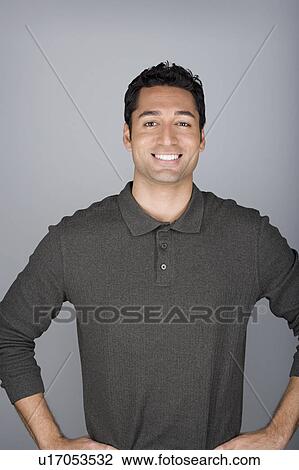 Studio shot portrait of mid adult man with hands on hip, waist up View Large Photo Image Stock Image - Studio shot portrait of mid adult man with hands on hip, waist up. Fotosearch