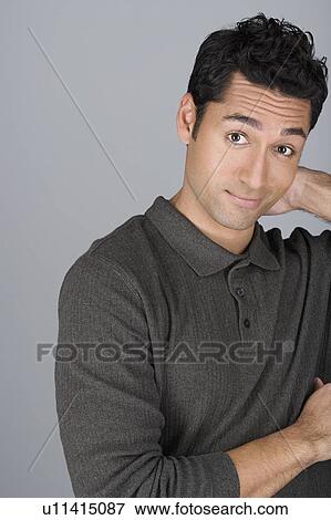 Stock Photo - Studio shot portrait of mid adult man, head and shoulders. Fotosearch